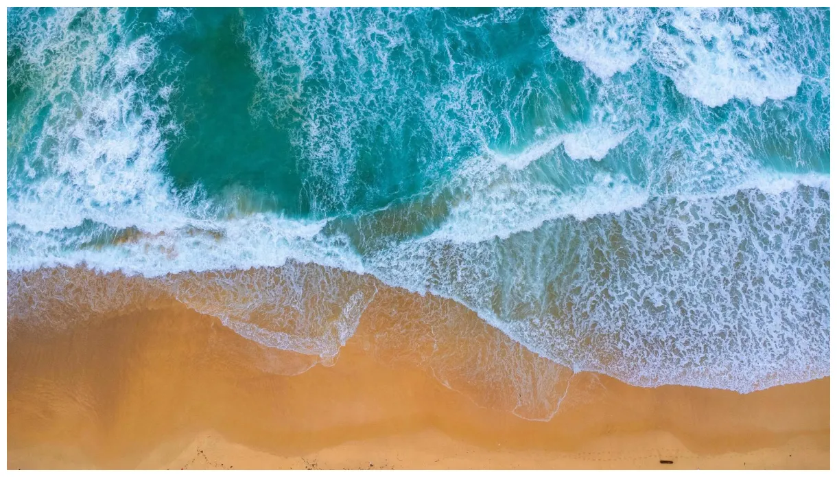 Beautiful sea waves and white sand beach in the tropical island. soft