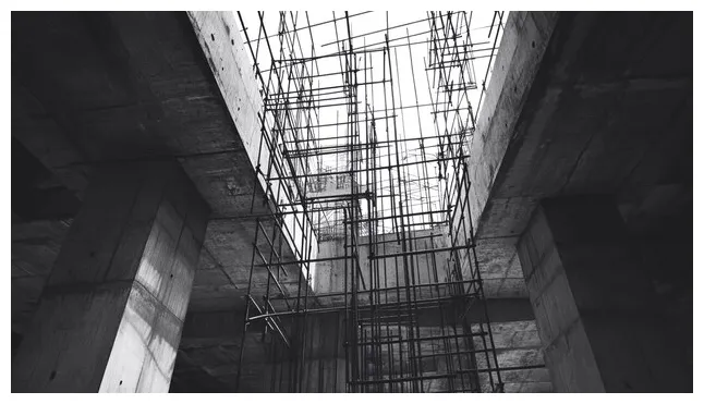 Concrete structures of a building construction with scaffolding