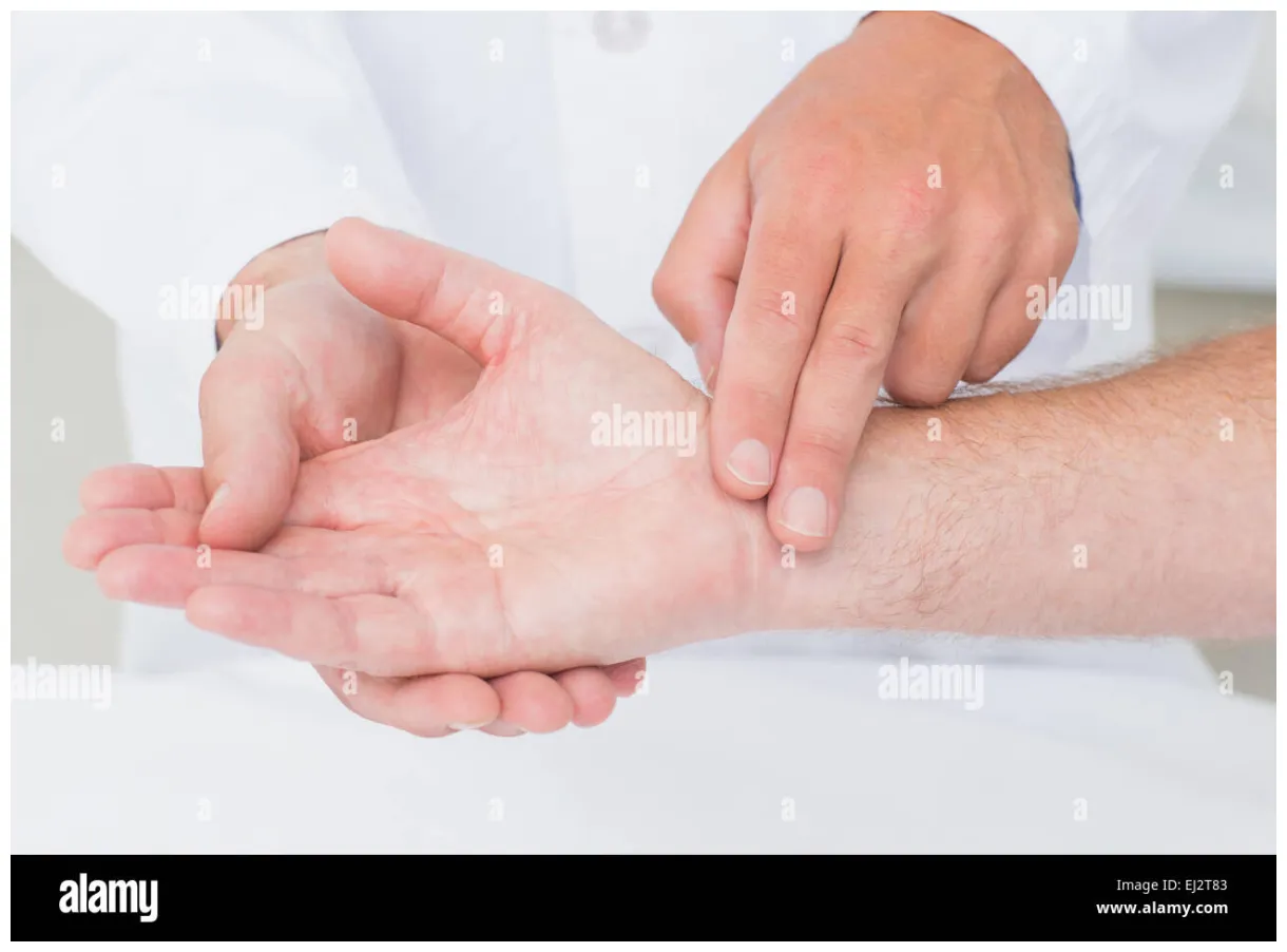 Male doctor checking patients pulse Stock Photo - Alamy
