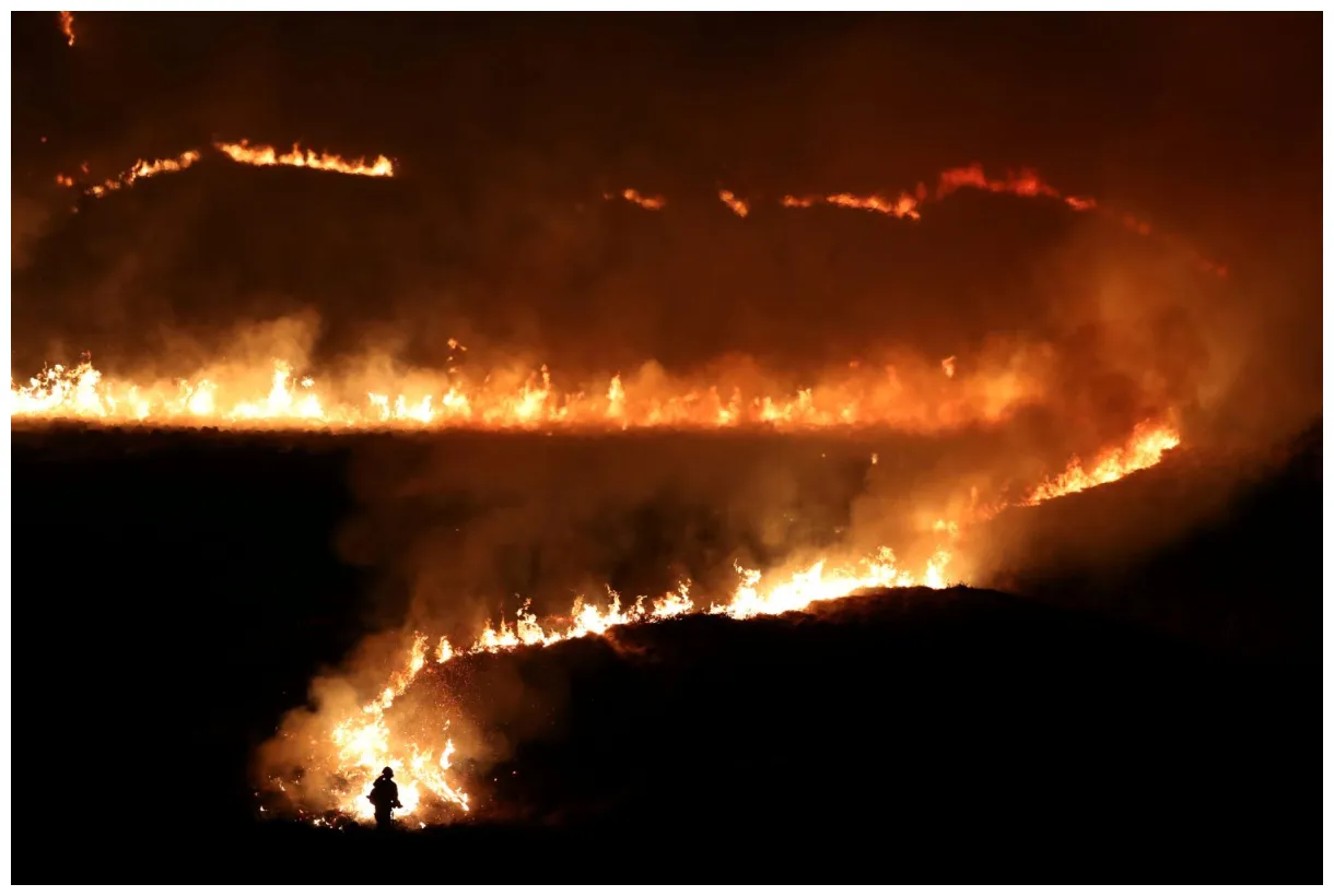 Wildfires rage across britain after hottest winter day on record