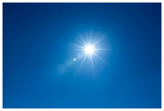 Premium low angle view of bright sun against blue sky printable coloring page